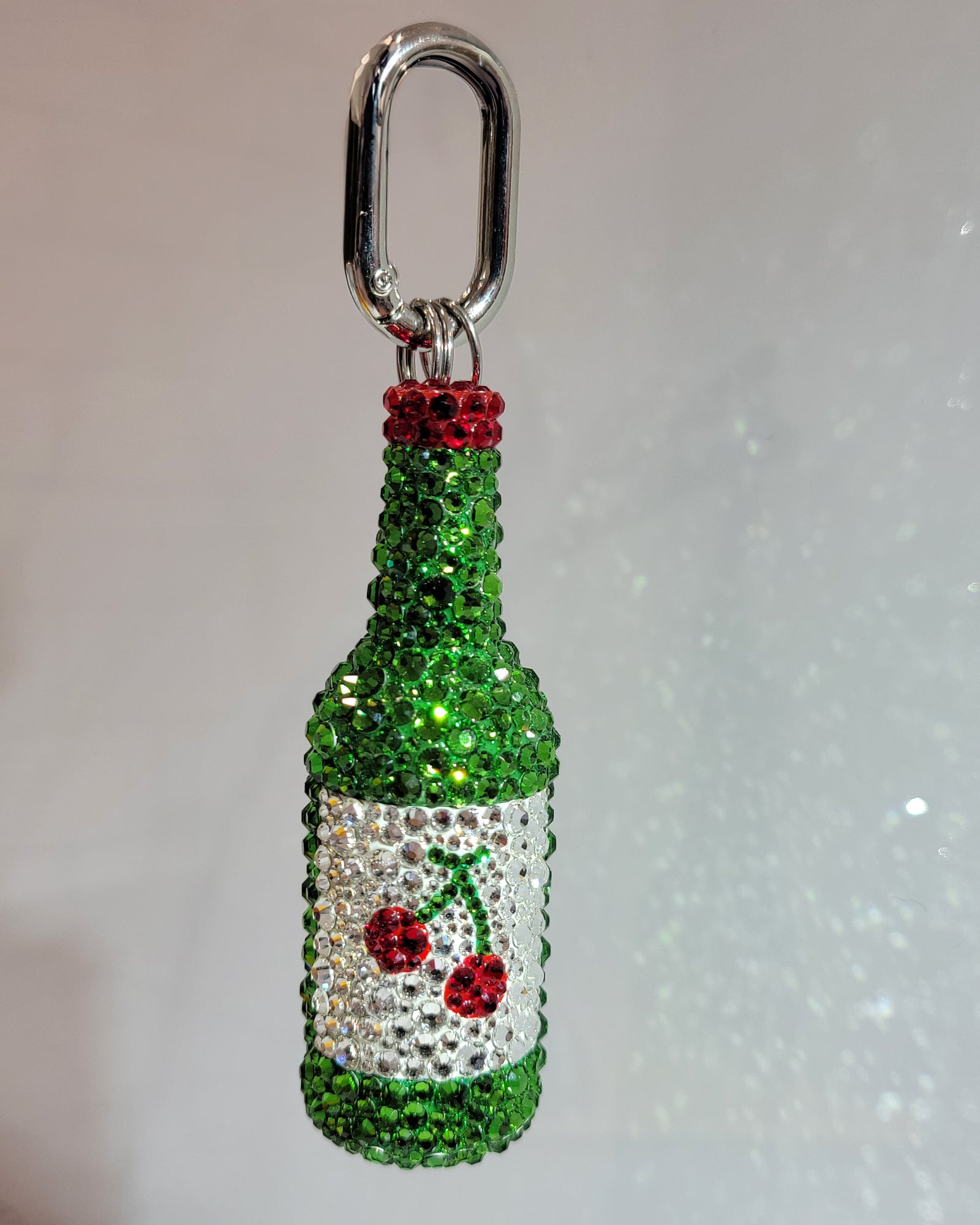 "Cherry" Soju keychain (a green soju bottle with a white label and a small cherry, featuring silver keychain hardware)