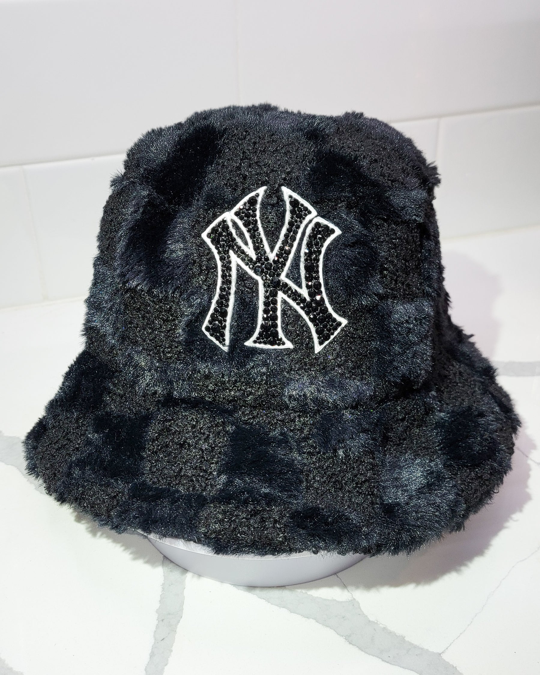 Front of Furry Checkered NYC Bucket Hat