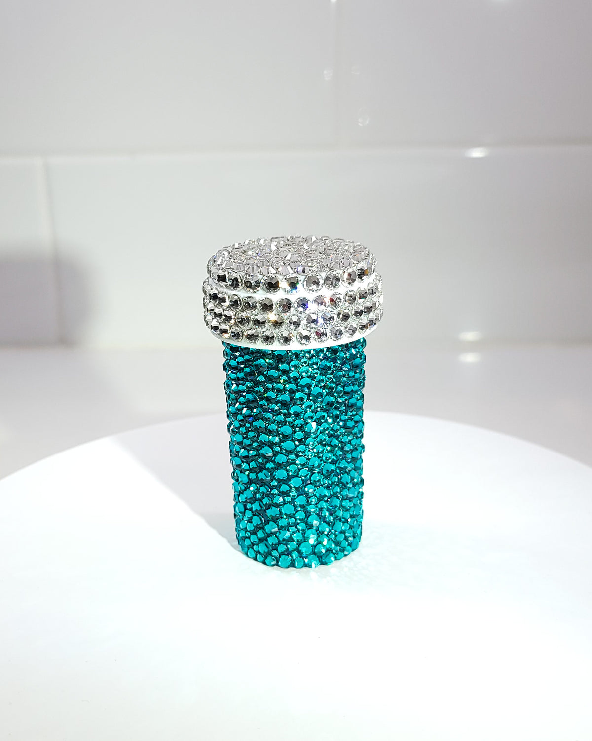 the back of the Smile Harder Pill Bottle, a fully rhinestoned pill bottle that is completely blue in the back.