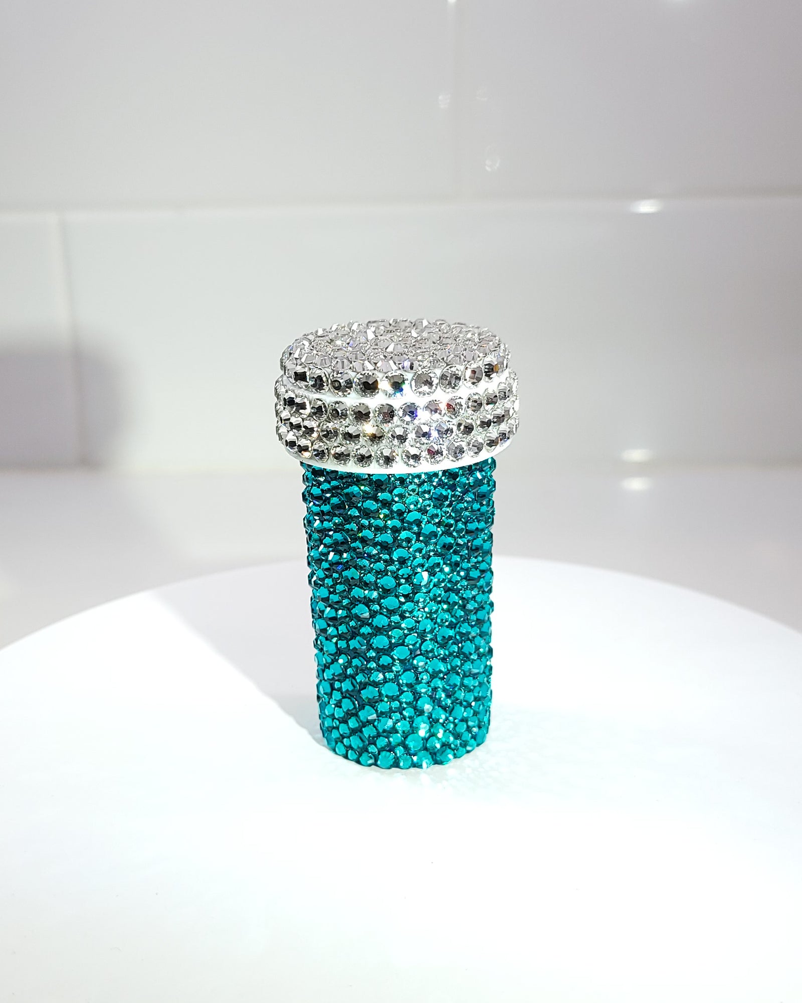 the back of the Smile Harder Pill Bottle, a fully rhinestoned pill bottle that is completely blue in the back.