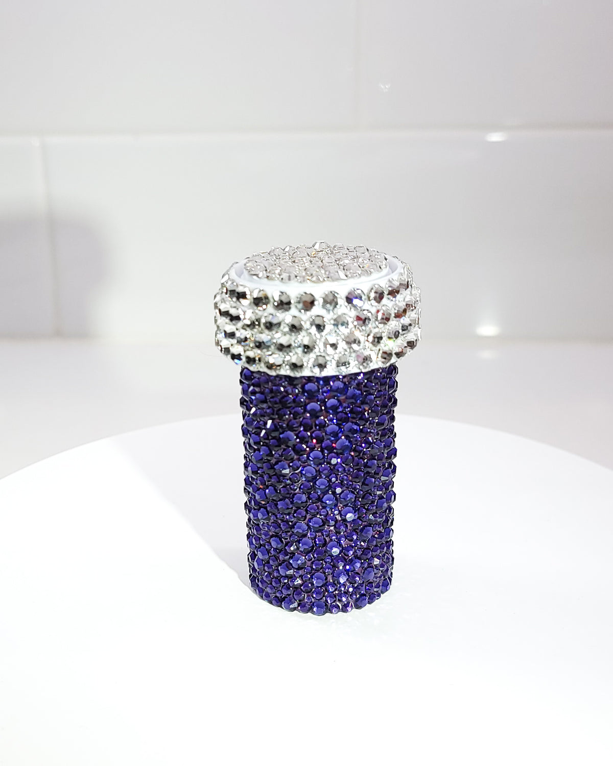 The back of the Dancheong Pill Bottle, a fully rhinestoned pill bottle with all purple rhinestones on the back.