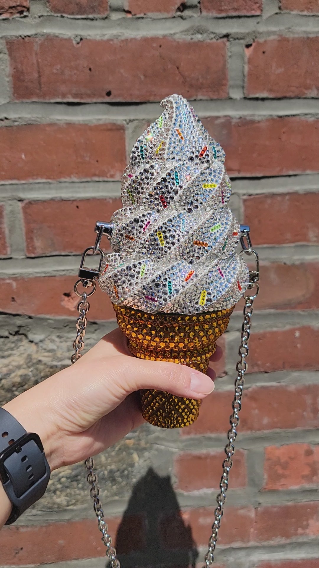 Soft Swerve Purse Video in Sunlight, being rotated against a brick wall.