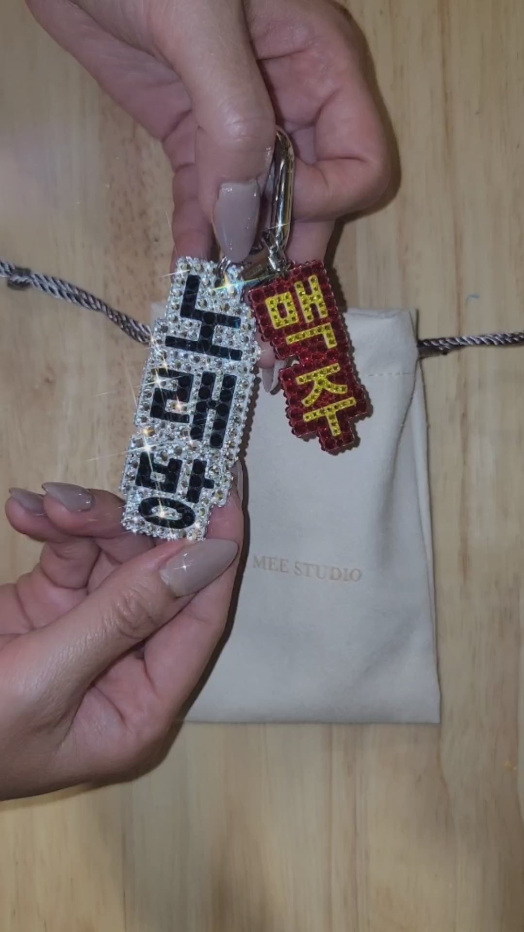 Video of Nightlife Karaoke Sign Bag Charm showing movement of key chain